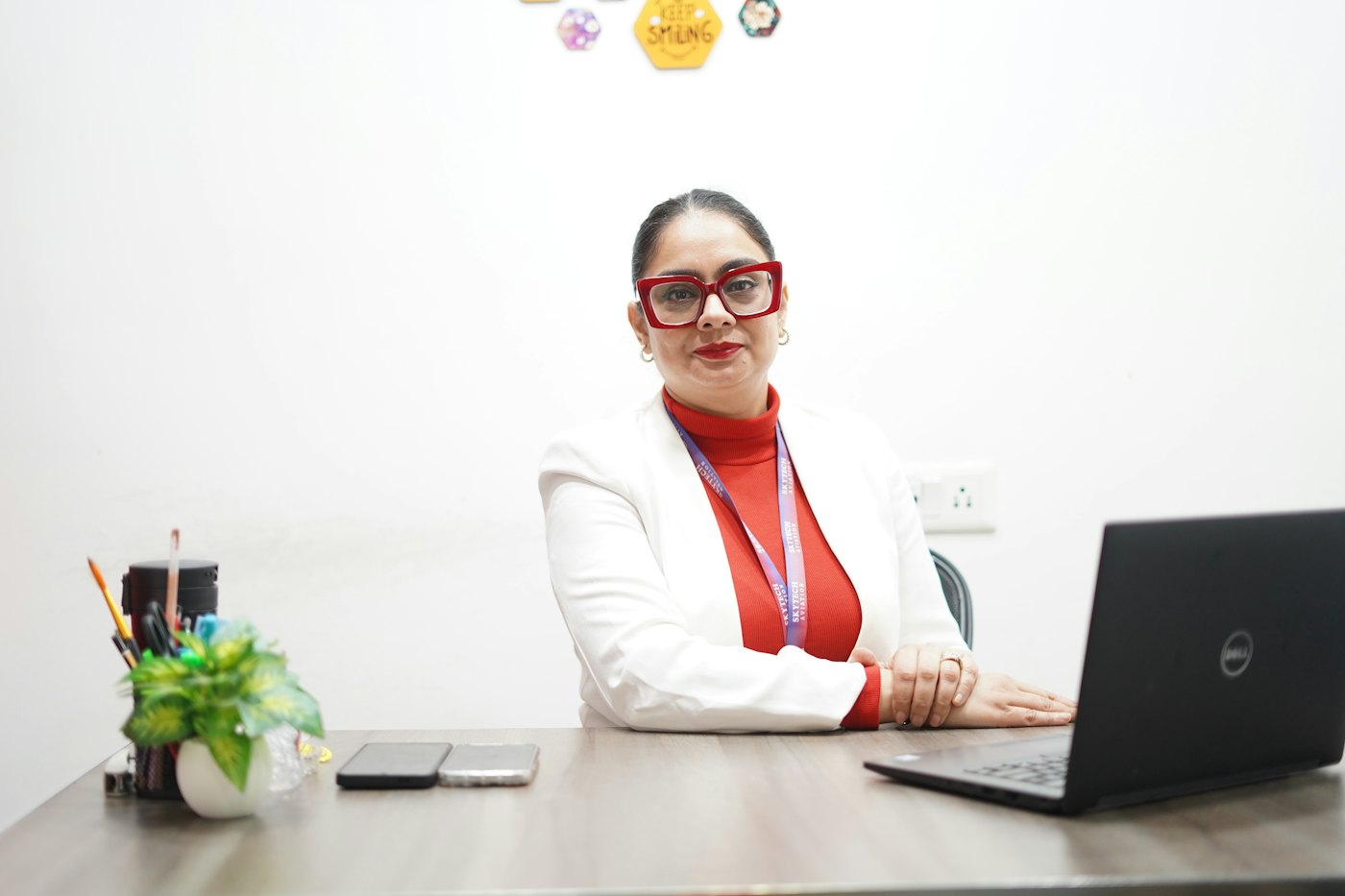 An HR manager at her desk with a laptop.